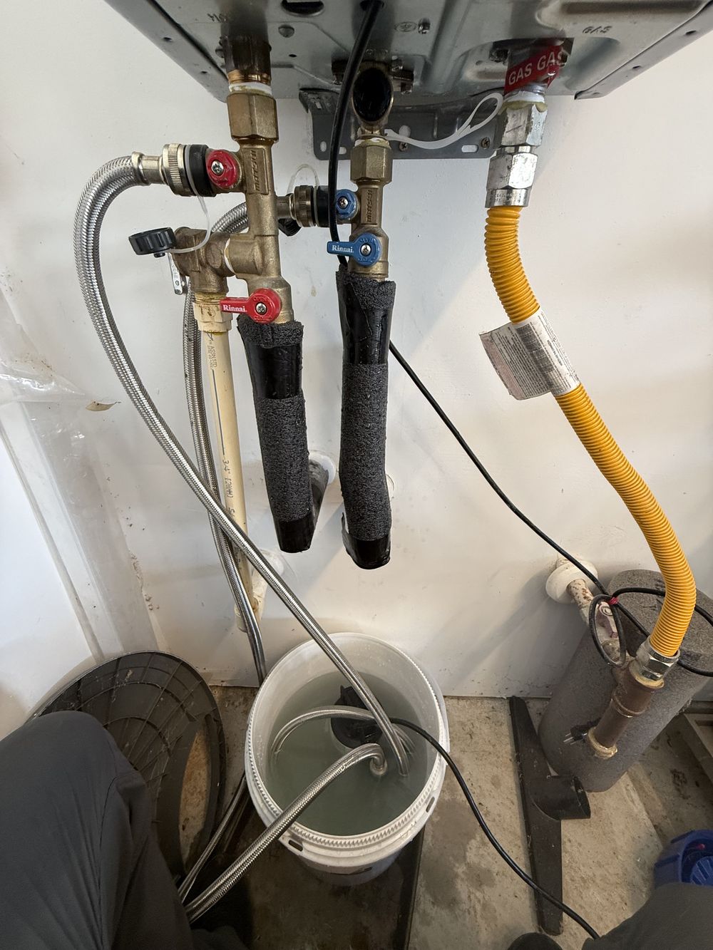 Tankless water heater isolation valves set up for a descaling flush