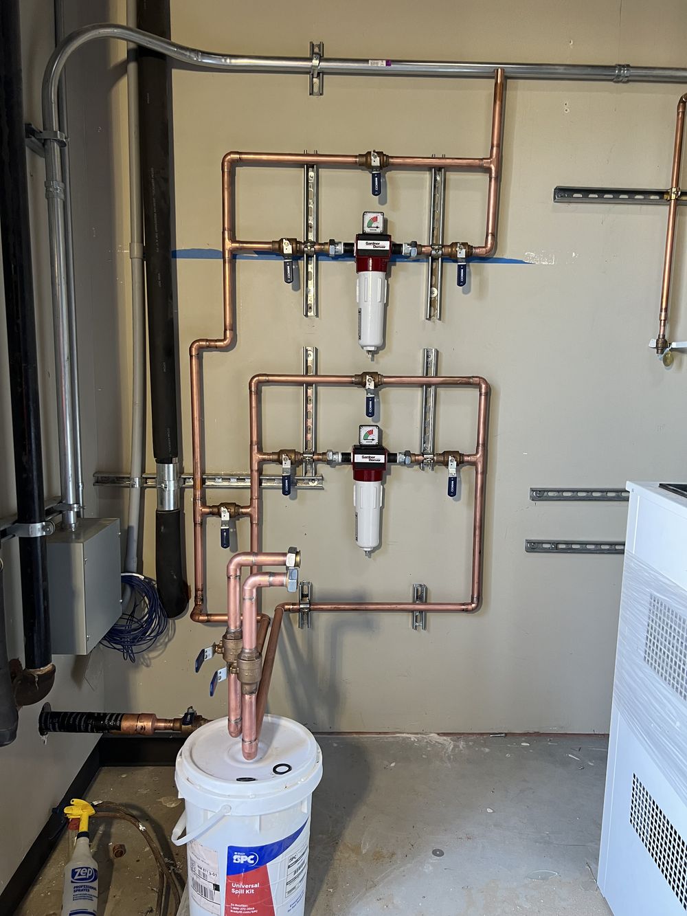Copper water manifold with filtration installed by Flush Plumbing Company