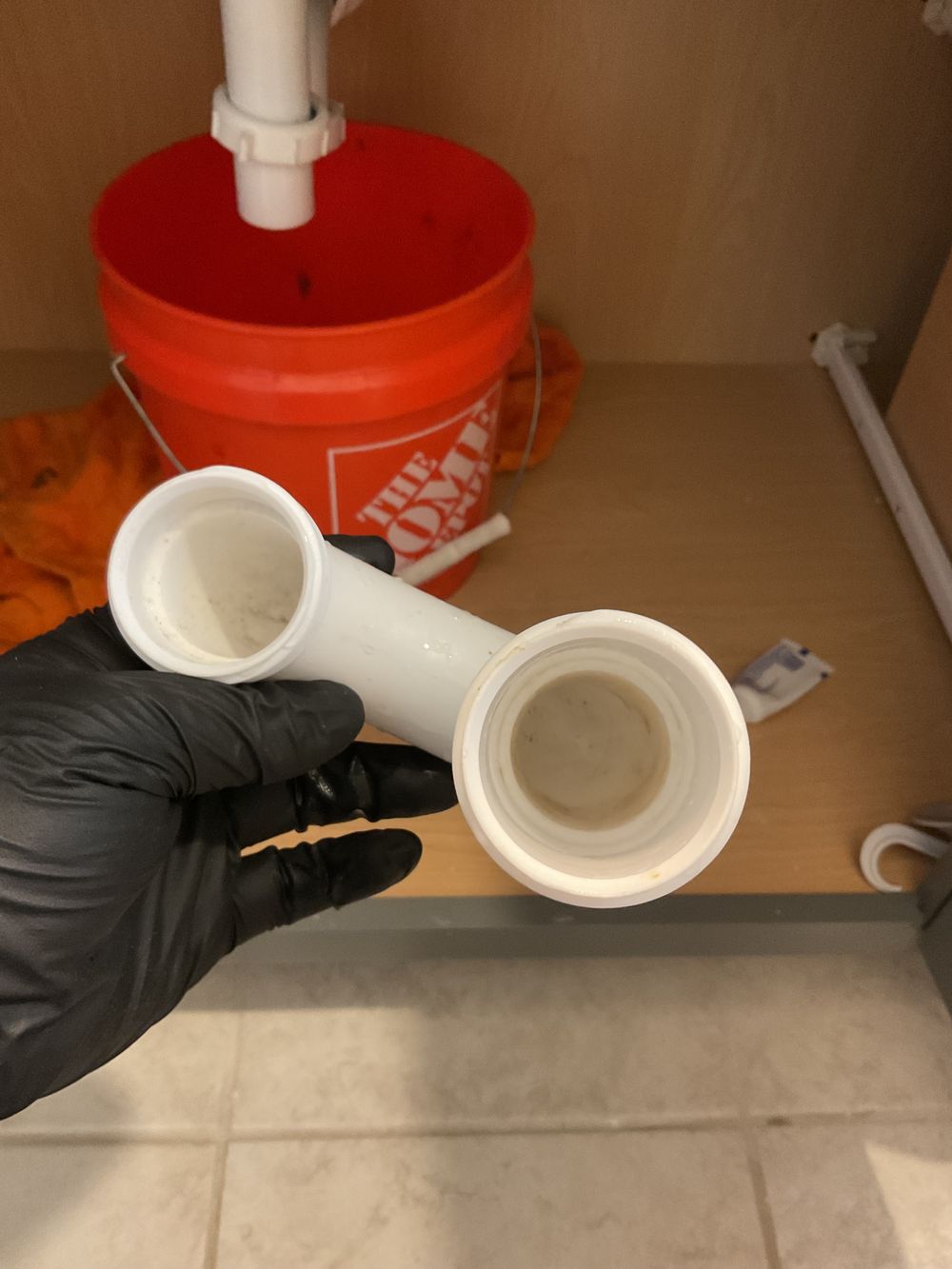 Blocked P-trap removed from under a sink